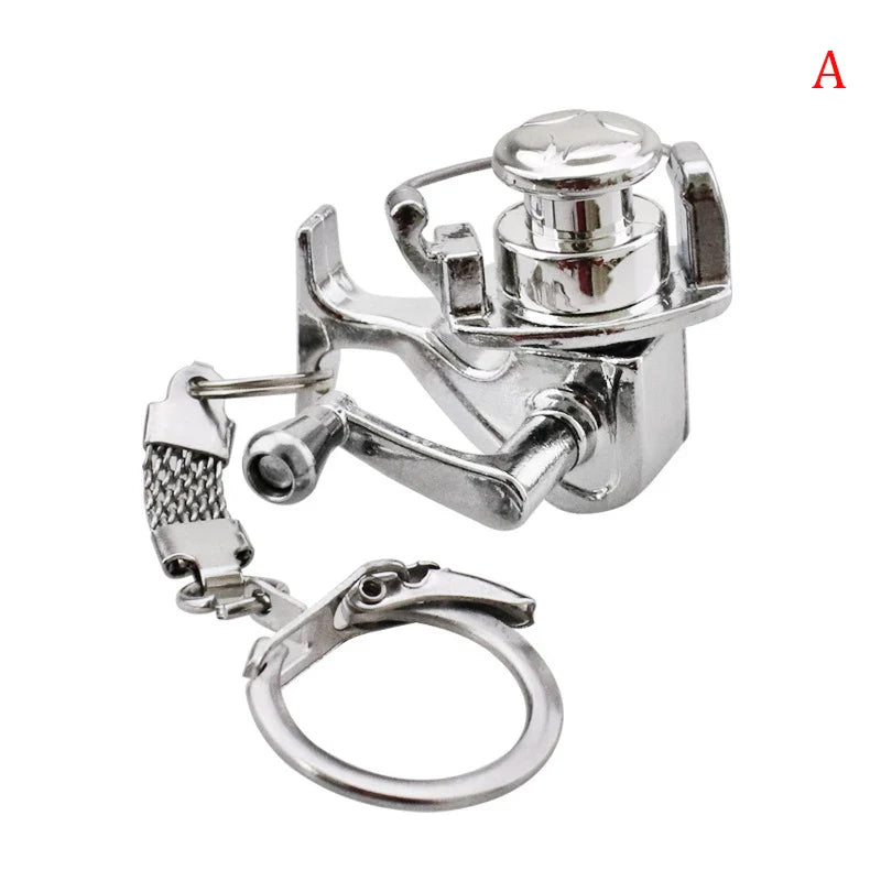 1Pcs Alloy Fishing Reel Drum Pendant Keychain Key Ring Outdoor Small Fishing Tackle Mini Miniature Sea Fishing Spinning Wheel