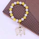 Stylish Stretch Elastic White Yellow Pearl Beads College Group Letter Shield Pendants Philo Bracelets