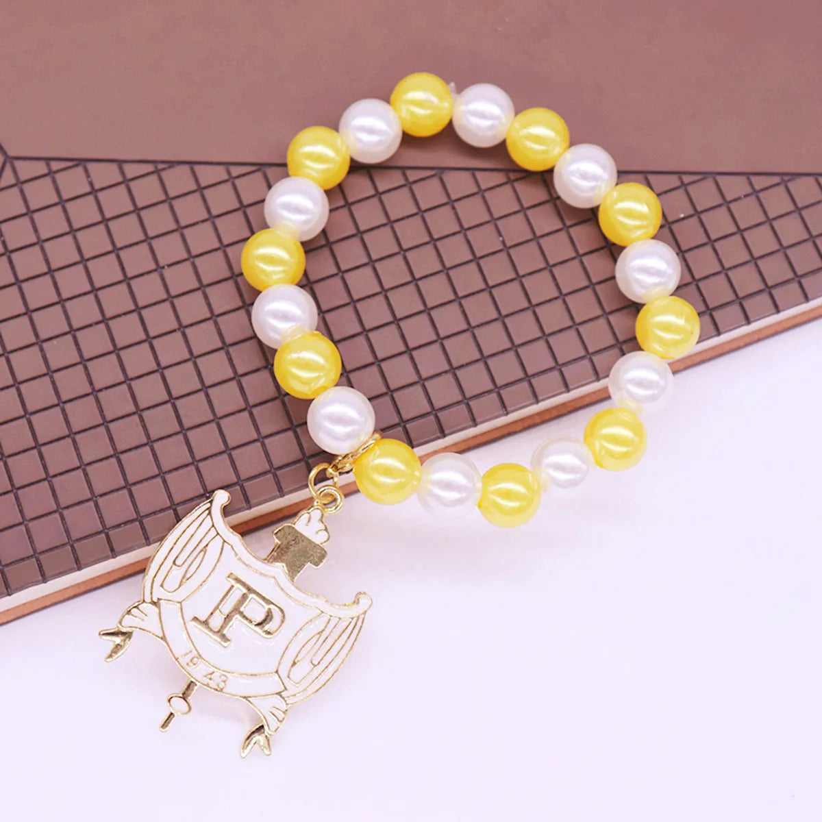 Stylish Stretch Elastic White Yellow Pearl Beads College Group Letter Shield Pendants Philo Bracelets