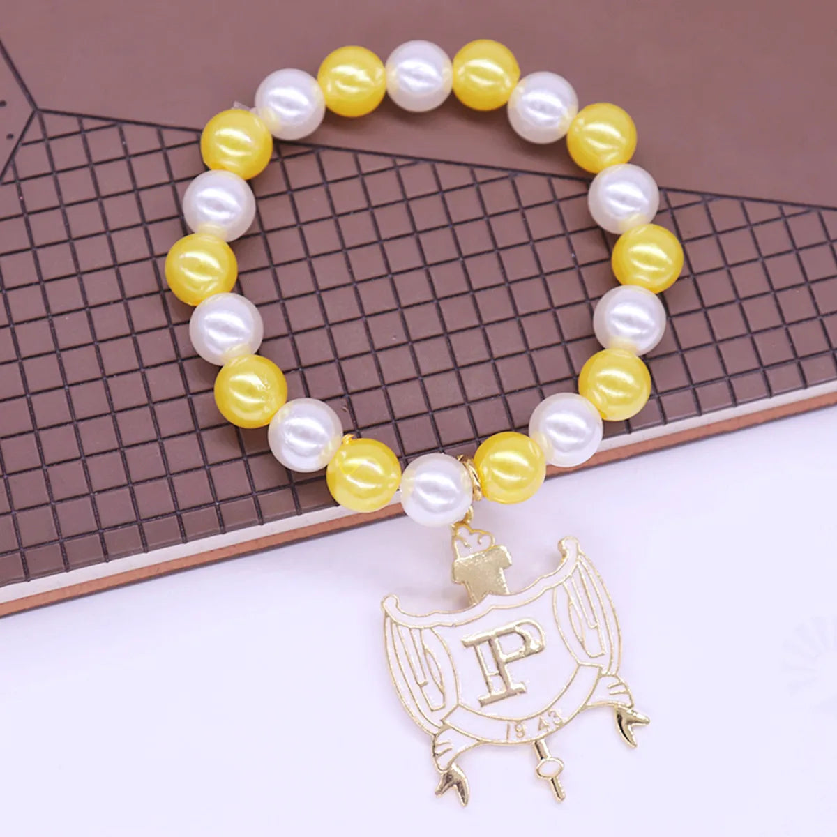 Stylish Stretch Elastic White Yellow Pearl Beads College Group Letter Shield Pendants Philo Bracelets